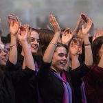 Choir with raised hands